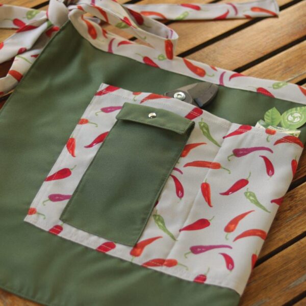 Gardening Apron in a vibrant chilli print.